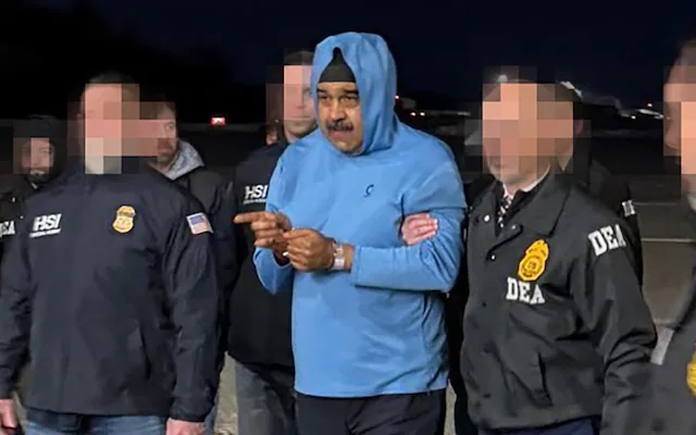 ვენესუელას პრეზიდენტი ნიკოლას მადურო სამართალდამცავი უწყებების წარმომადგენლების თანხლებით დაკავების მომენტში — კადრი, რომელმაც საერთაშორისო სკანდალი გამოიწვია